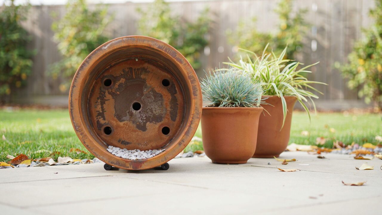 Drainage Hole Setup for corten planter Close up of corten steel planter bottom with drainage holes